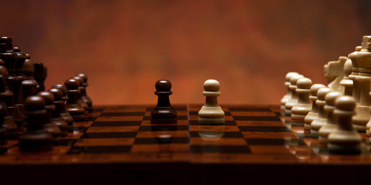 aligned chess pieces as example of hiring for core capabilities vs technical competencies